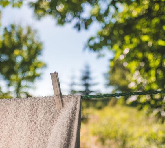 laundry-towel-clothes-line-peg A towel drying on the clothes line outside.