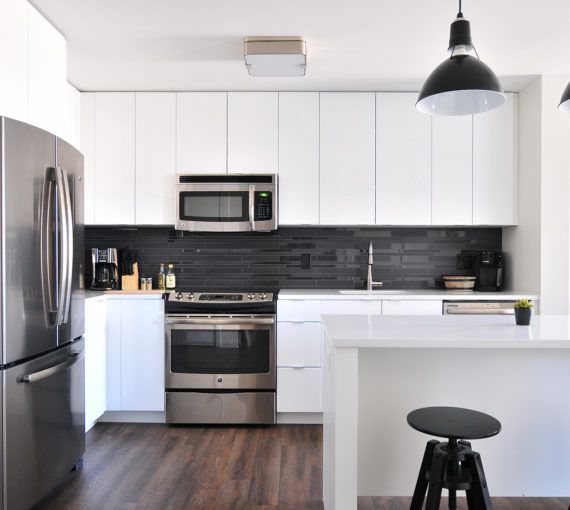 A modern kitchen with stainless steel appliances.