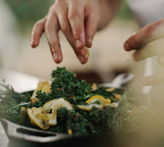 environmental-benefits-plant-based-meals Cooking a meal full of vegetables