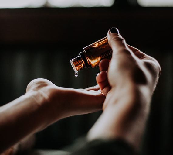 essential-oil Dropping essential oil onto hands