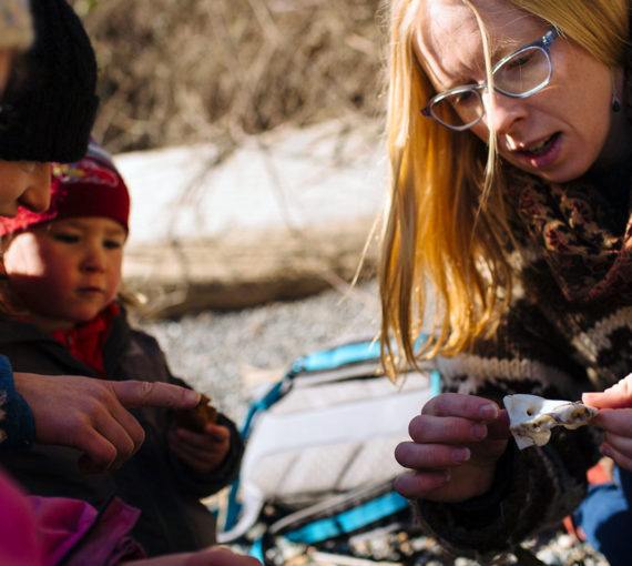 Woman leads nature lesson with young children