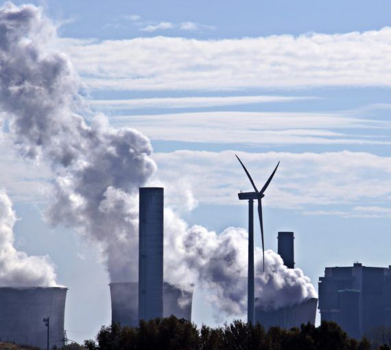 coal-fired-power-plant-3767893 Wind turbine with coal power plant in background