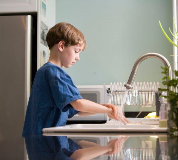 young-boy-washing-his-hands Young boy washing his hands