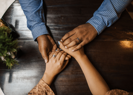 Hands supporting each other while pondering green end-of-life options